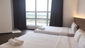 A hotel room with two beds, a large window, and a view of the outdoors. - Place2Stay Business Hotel @ Metrocity (Kuching)