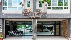 A building with a sign reading "angel pension" and a row of bicycles parked outside. - Angel Pension (Taitung)