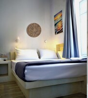 Habitación doble | Caja fuerte, sistema de insonorización, tabla de planchar con plancha
