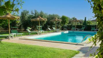 Seasonal outdoor pool, open 7:30 AM to 8:00 PM, pool umbrellas