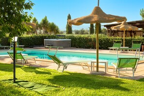 Seasonal outdoor pool, open 7:30 AM to 8:00 PM, pool umbrellas