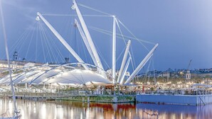 A modern bridge with a complex truss structure spanning over a body of water. - Stunning apartment in Genova (GE) (Genova (GE))