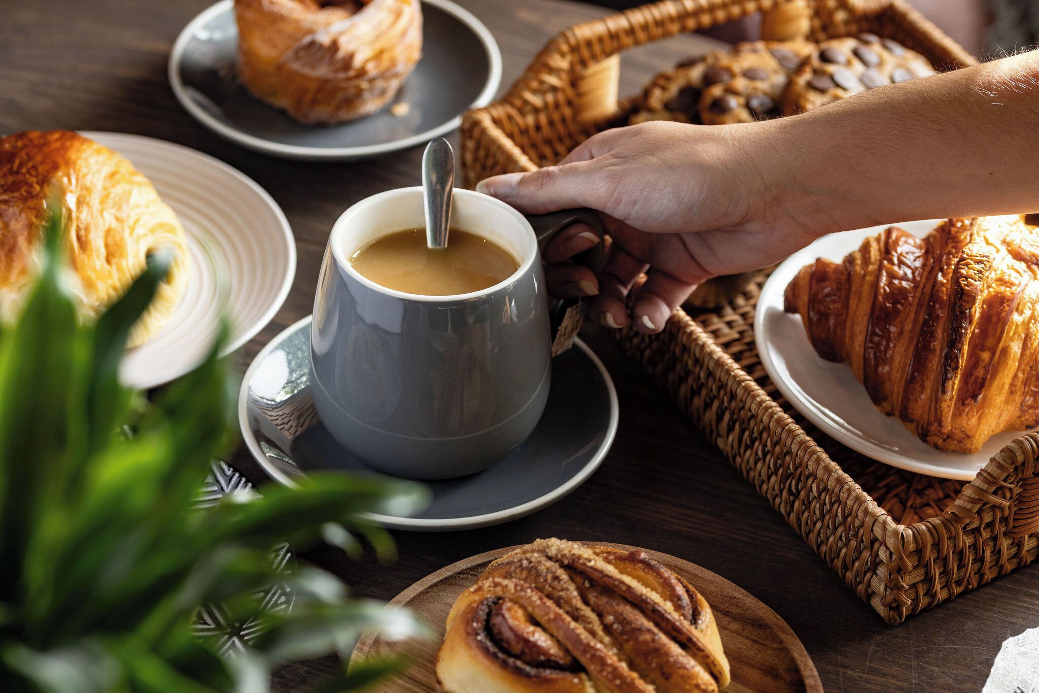 A table with pastries and a cup of coffee.