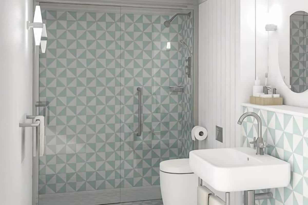 A bathroom with a geometric tile pattern, a toilet, a sink, and a shower.