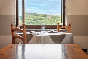 Lunch, dinner served; local cuisine, garden views 