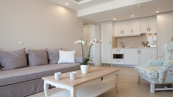 Apartamento luxo | Área de estar | TV de tela plana