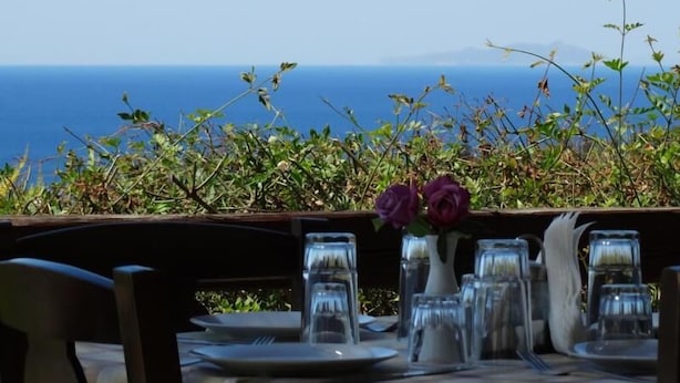 A table set for dining with a view of the ocean. - Ktima Nikola (Karystos)