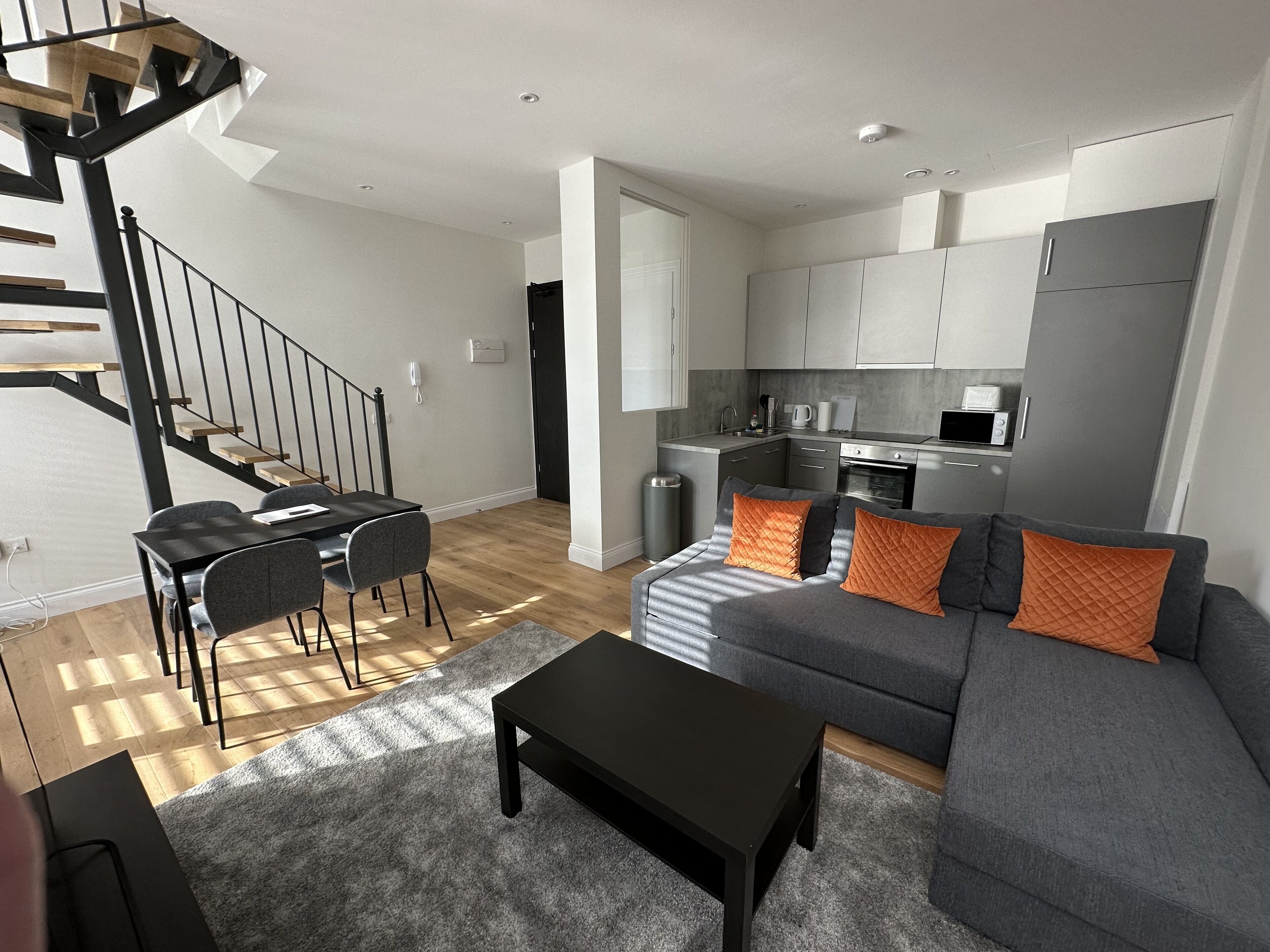 comfort apartment, 1 double bed | living area | flat-screen tv