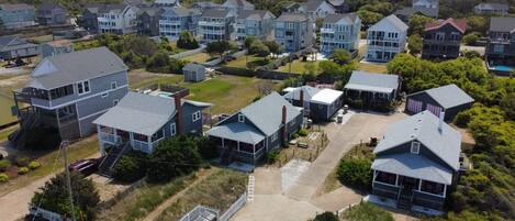 A residential area with multiple two-story houses, some with attached garages and driveways.