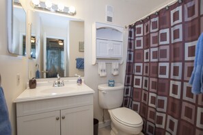 Combined shower/tub, hair dryer, towels, soap