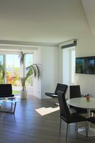 Deluxe Suite | Living area | Flat-screen TV