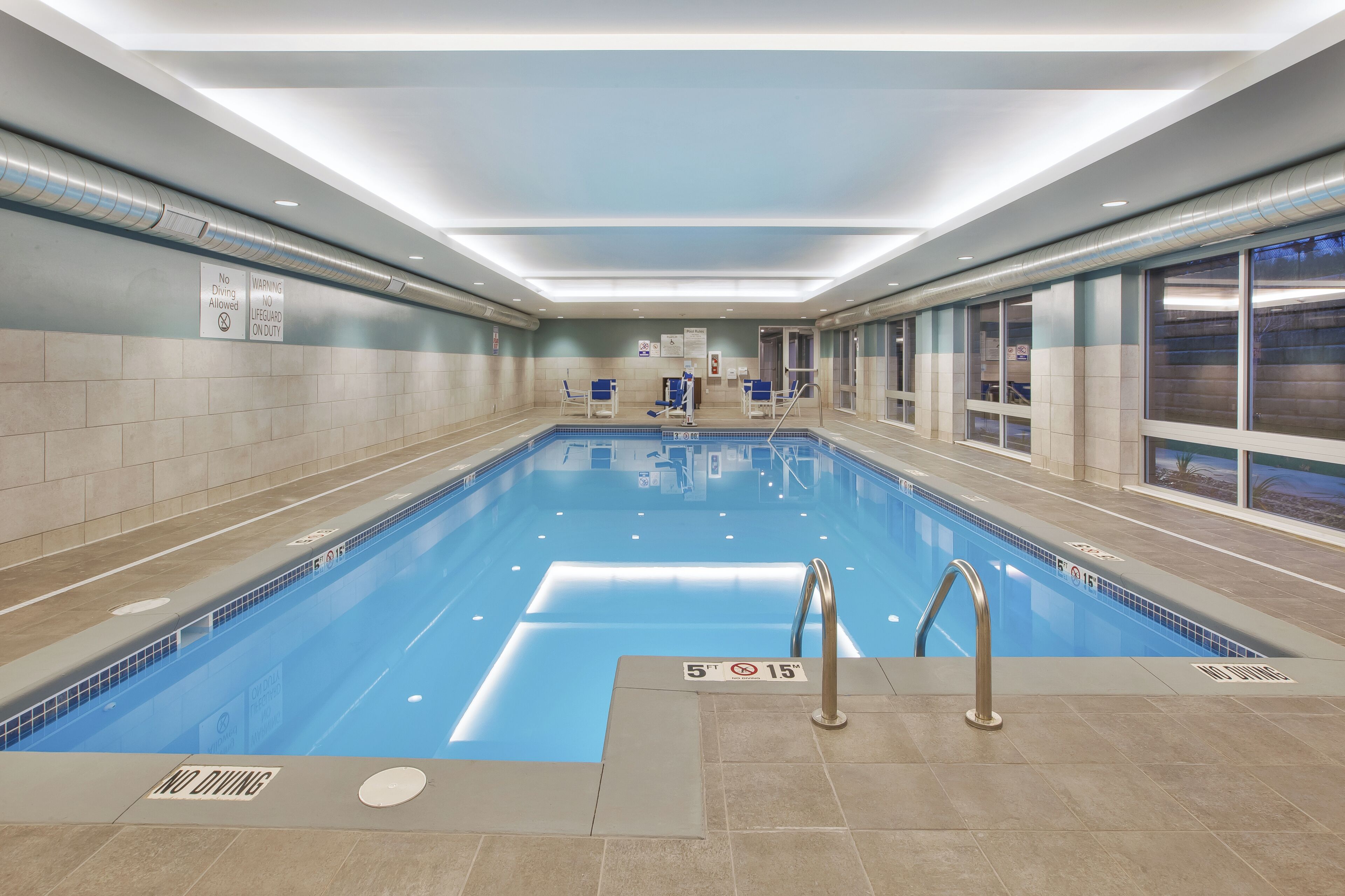 indoor pool, open 7:00 am to 10:00 pm, pool loungers