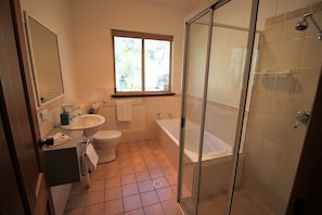 Bathtub, hair dryer, towels, soap