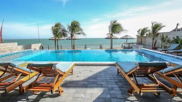 Outdoor pool, pool umbrellas, sun loungers