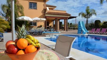 Outdoor pool, a heated pool, sun loungers