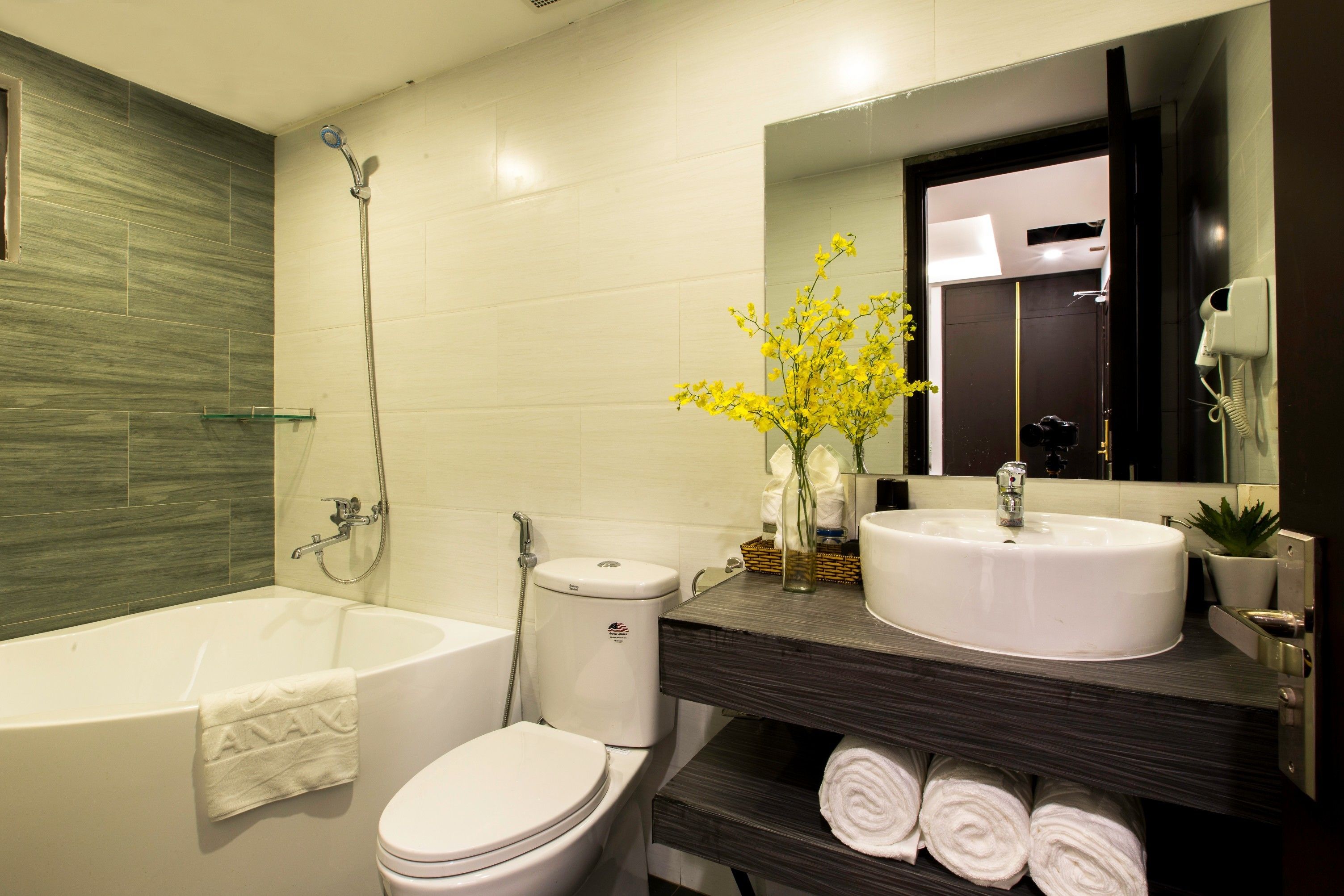 deluxe king room | bathroom | free toiletries, hair dryer, slippers, bidet