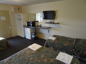 A hotel room with two beds, a kitchenette, a TV, and a small desk. - Paringa Hotel Motel (Paringa)