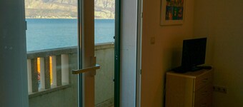 Modern studio with balcony views across the glistening Adriatic