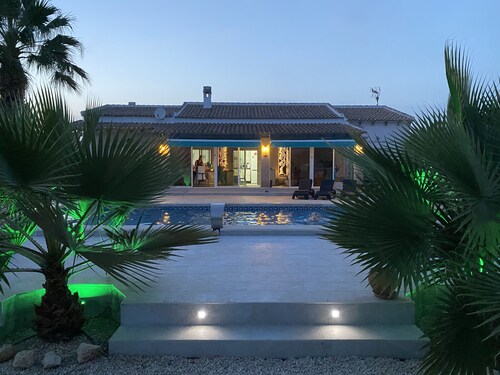 Modern villa with large garden and heated pool near the sea