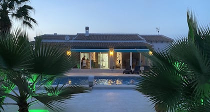 Modern villa with large garden and heated pool near the sea