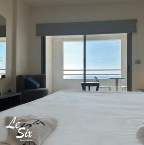 Deluxe Double Room, 1 Bedroom, Balcony, Beach View | Minibar, in-room safe, desk, rollaway beds