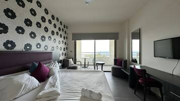 Standard Room, 1 Bedroom, Balcony, Beach View | Minibar, in-room safe, desk, rollaway beds