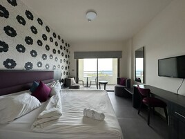 Standard Room, 1 Bedroom, Balcony, Beach View | Minibar, in-room safe, desk, rollaway beds
