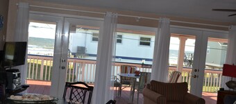 Few Steps from beach, fabulous view from ginormous gated deck!