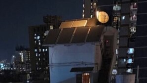 A multi-story hotel with balconies, a rooftop terrace, and a well-lit entrance area. - Hotel Al Saudia (Mumbai)