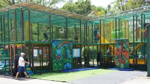 A playground with netted play structures and artificial grass. - The Camping Site Hamat Gader (Hamat Gader)