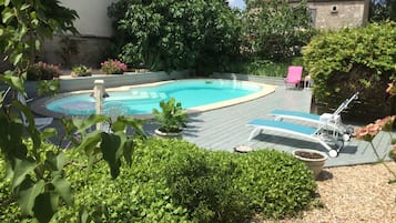 Seasonal outdoor pool, open 10 AM to 7:30 PM, pool loungers