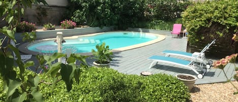 Seasonal outdoor pool, pool loungers