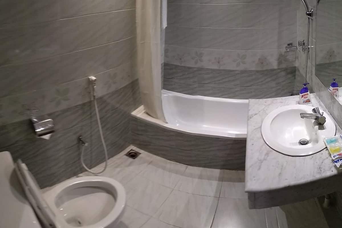 exclusive suite, 1 king bed | bathroom | shower, free toiletries, hair dryer, towels