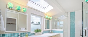 Combined shower/tub, hair dryer, towels, soap