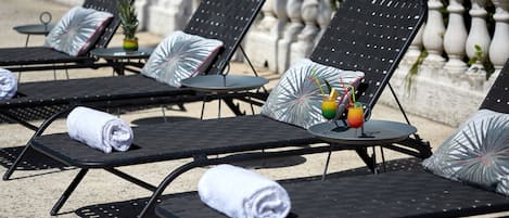 Seasonal outdoor pool, open 8:00 AM to 7:30 PM, pool umbrellas