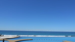 A pool with a view of the ocean.