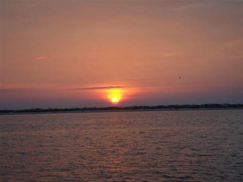 Adorable Beach Cottage. Full size swimming pool shared by four units in building
