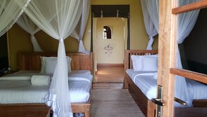 A room with two beds, each with a canopy, a small sink, and a mirror. - Lake Chahafi  Resort (Kisoro)