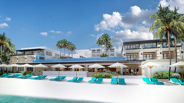 A resort with a poolside area, sun loungers, umbrellas, and palm trees. - Henann Palm Beach Resort (Boracay Island)