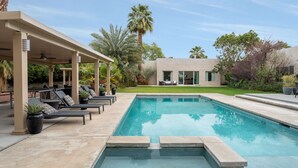 A swimming pool with lounge chairs and a covered patio area. - Secluded 1-Acre Mountain View Retreat - great location in La Quinta  #112390 6BR (La Quinta)
