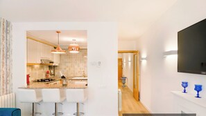 Fridge, oven, coffee/tea maker, toaster