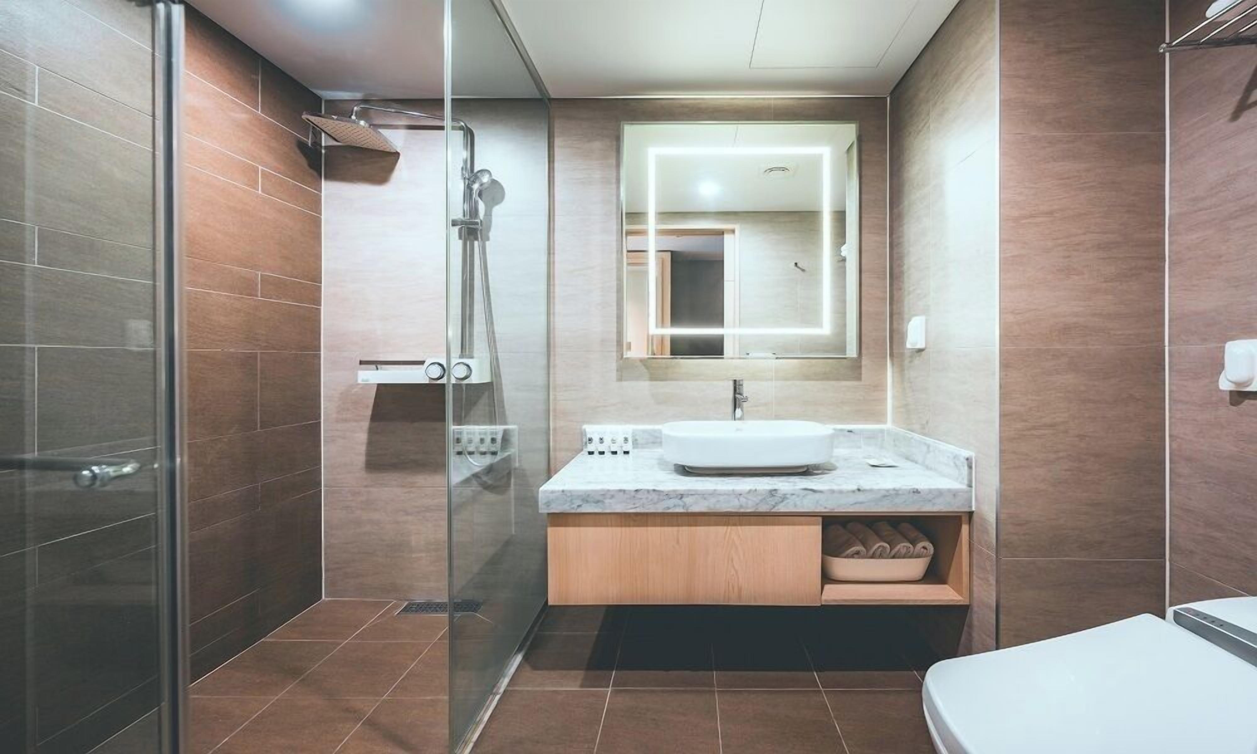 superior twin room | bathroom | shower, free toiletries, hair dryer, bathrobes