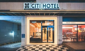 The exterior of the Citi Hotel with a checkered floor pattern and a sign above the entrance. - Wonju City Hotel HYEOKSIN (Wonju)