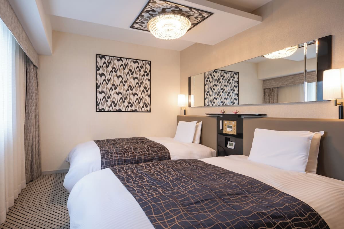 Tvåbäddsrum Deluxe - 2 sovrum | Duntäcken, skrivbord, mörkläggningsgardiner och gratis wi-fi