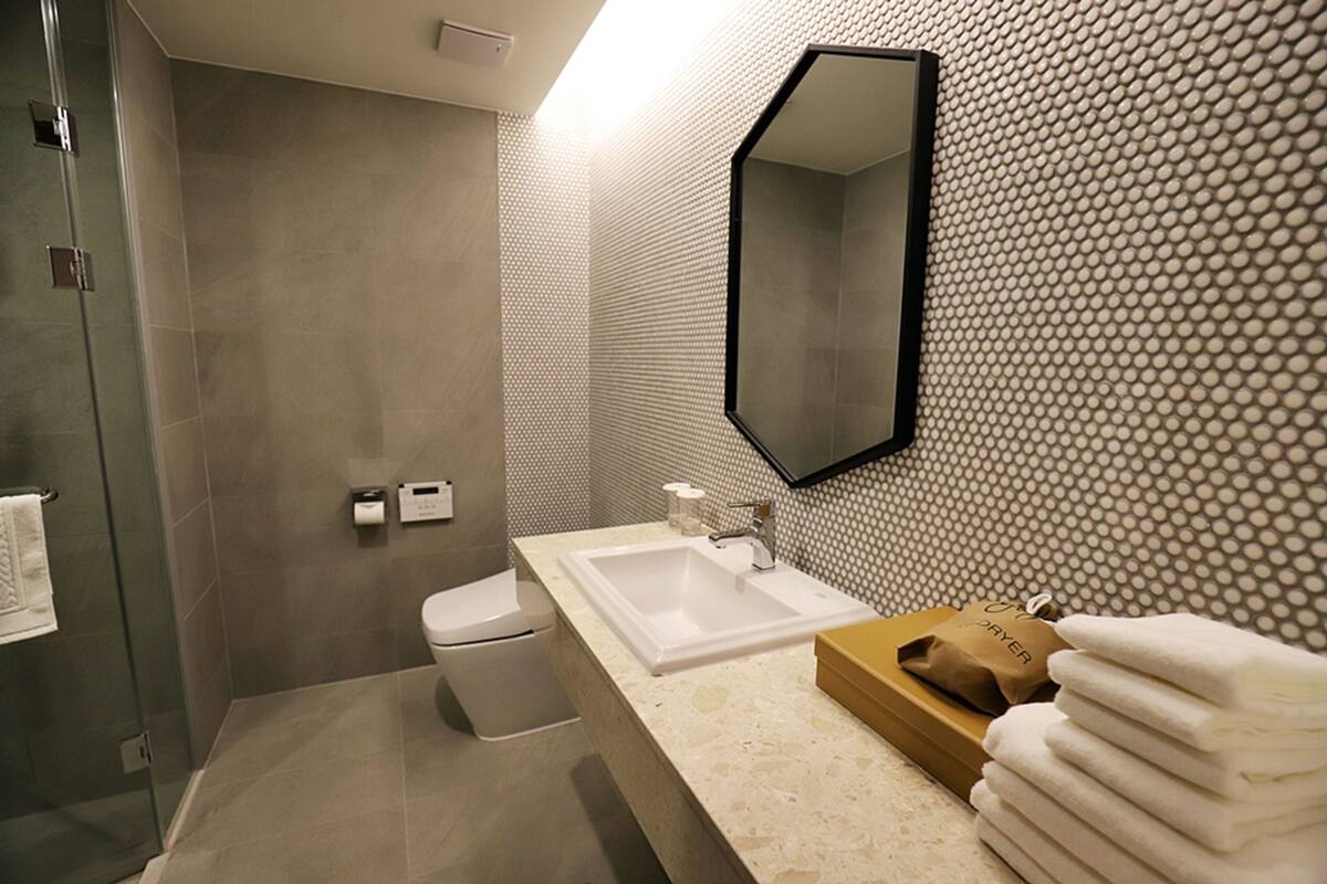 shower, hair dryer, bathrobes, towels