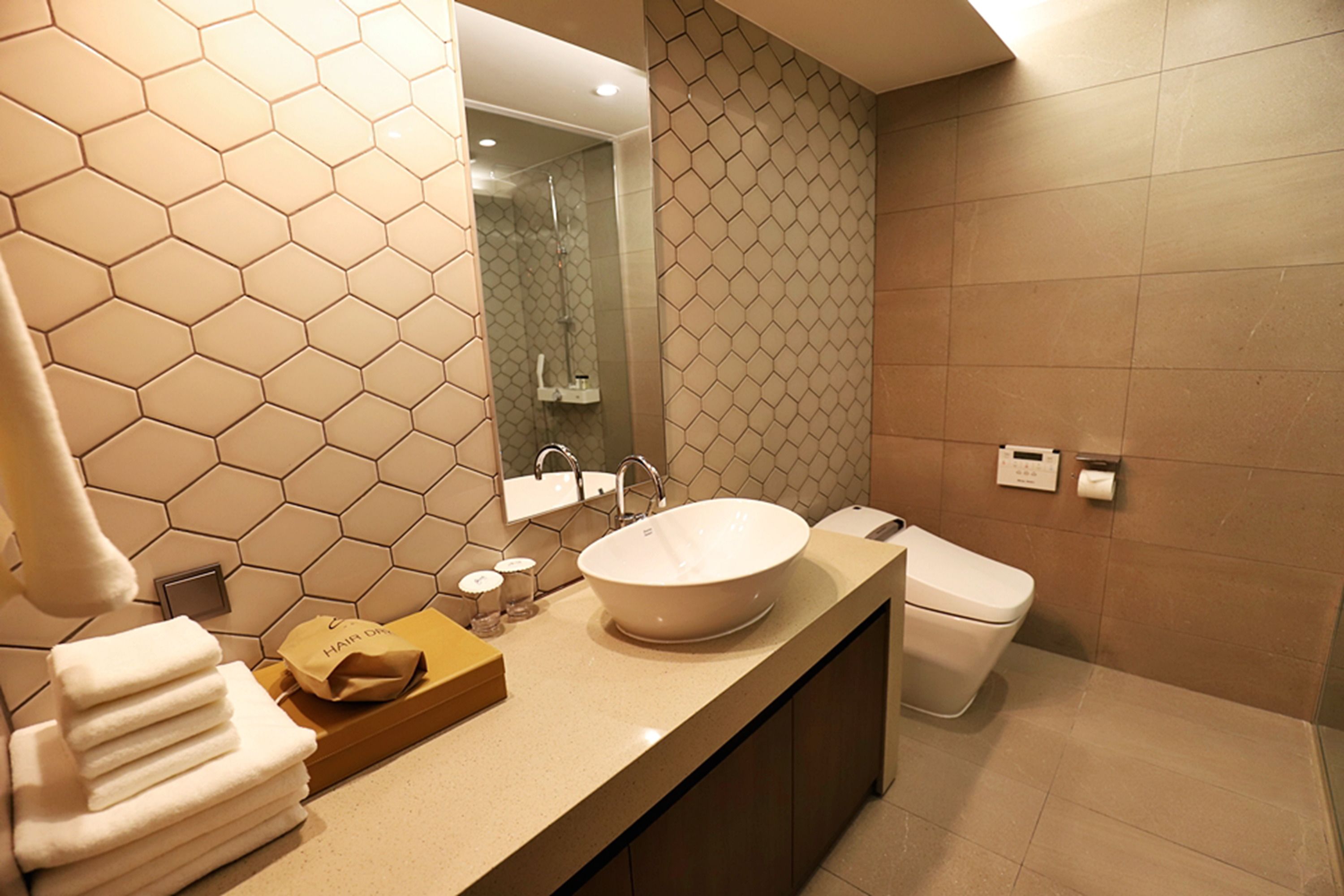 deluxe twin room | bathroom | shower, hair dryer, bathrobes, towels