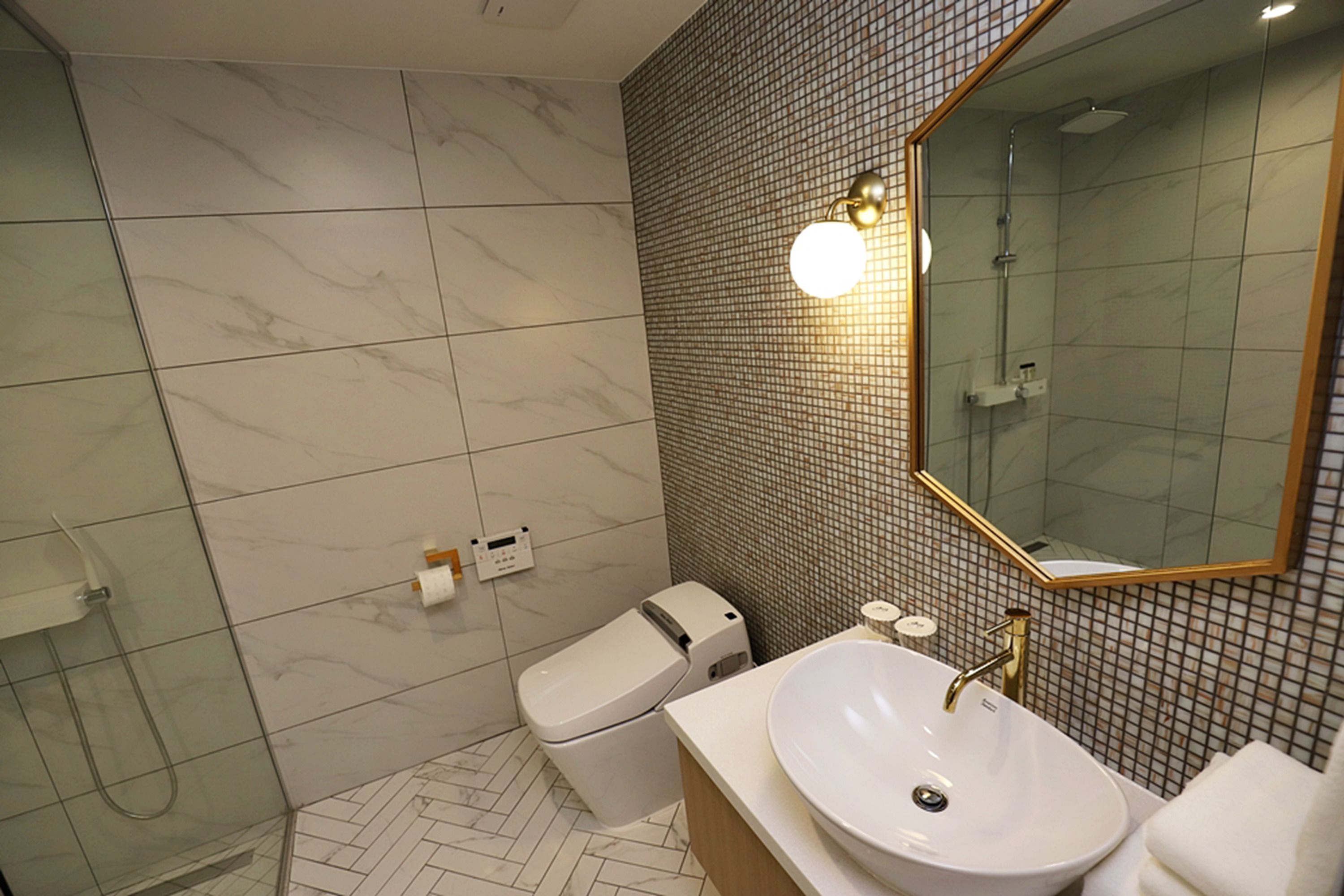 superior twin room | bathroom | shower, hair dryer, bathrobes, towels