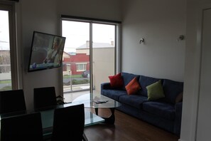 Executive Apartment, 1 Bedroom | Living room | Flat-screen TV, DVD player