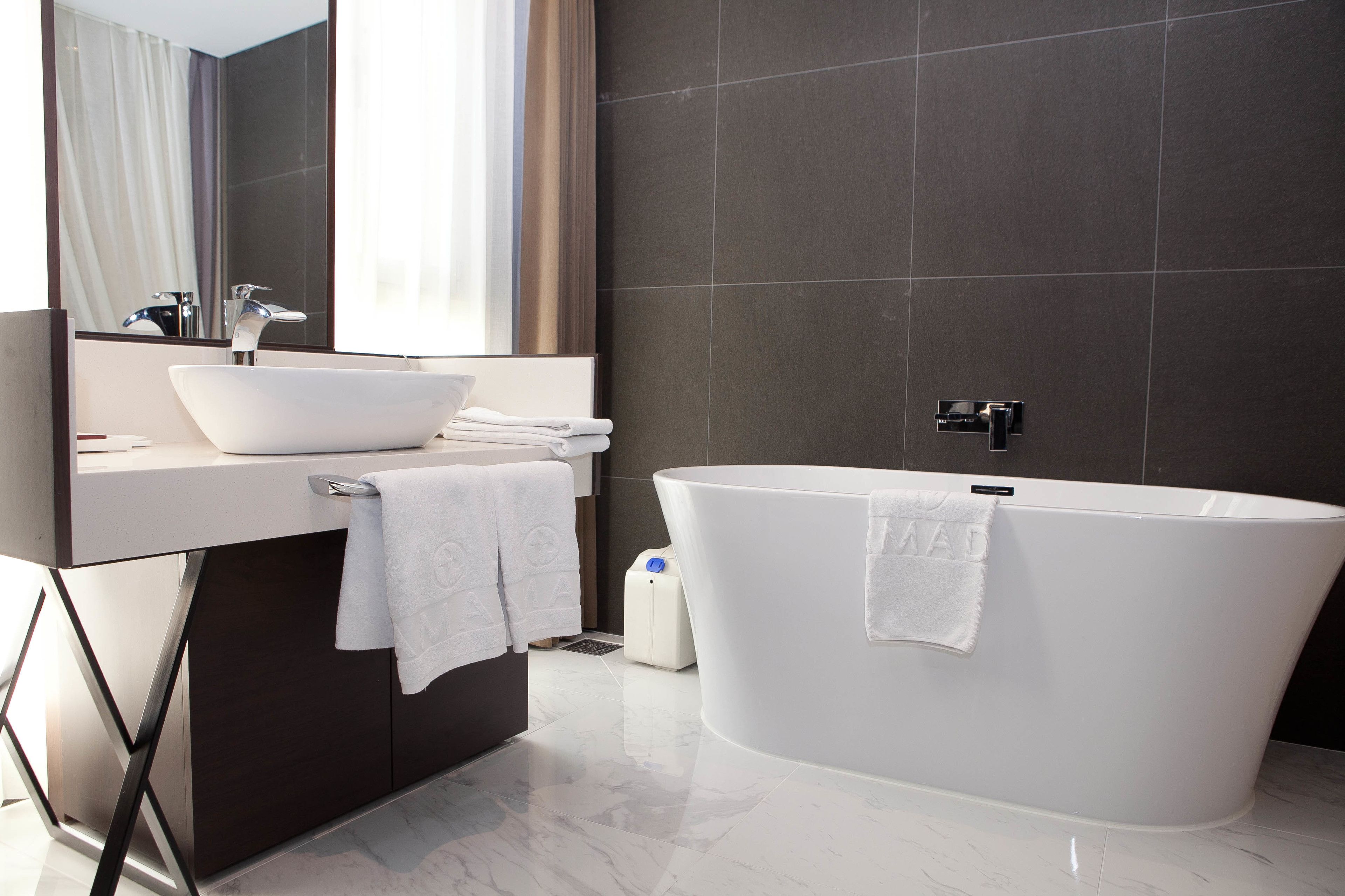 separate bathtub and shower, deep-soaking bathtub, hair dryer, slippers