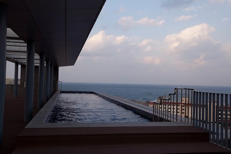 Seasonal outdoor pool, open 11:00 AM to 6:00 PM, sun loungers
